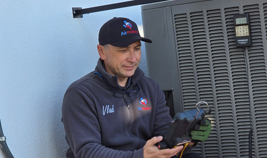 hvac technician inspect outdoor air conditioning