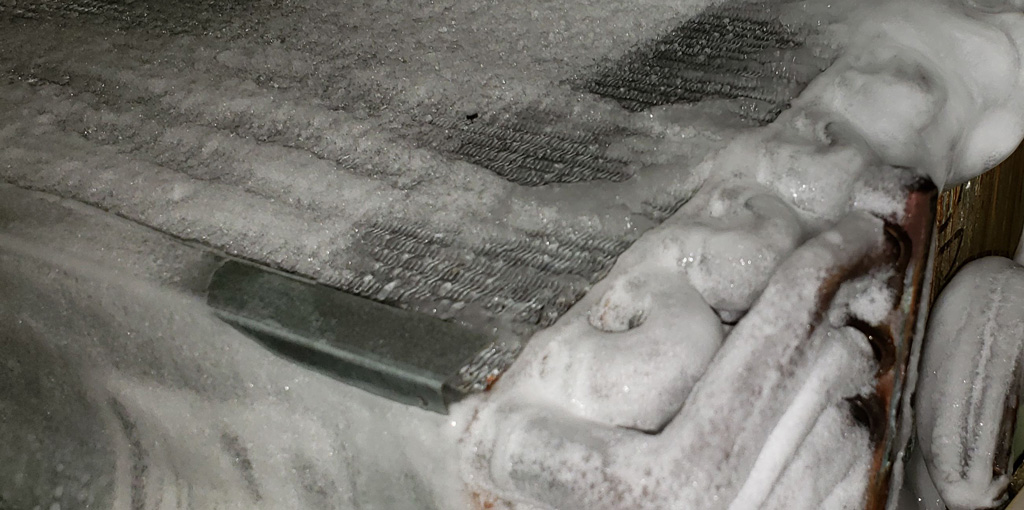The frozen coils and refrigerant lines